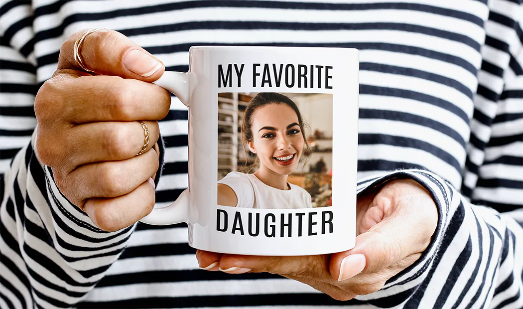 Mum and baby holding Printerpix cartoon design custom mug with dad text