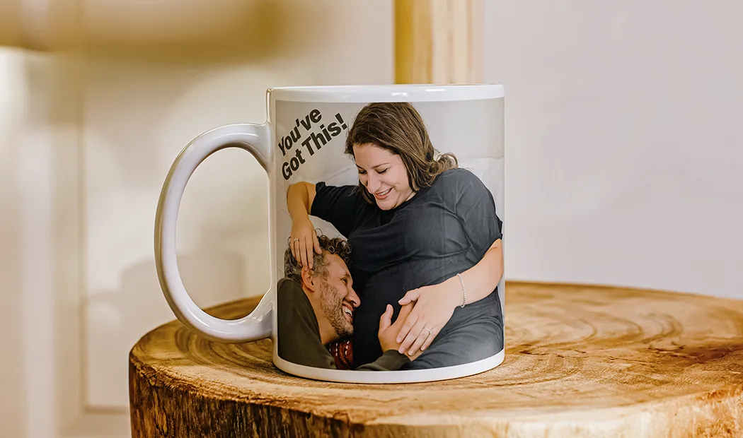 Mum and baby holding Printerpix cartoon design custom mug with dad text