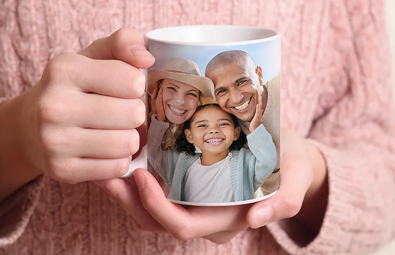 Mum and baby holding Printerpix cartoon design custom mug with dad text