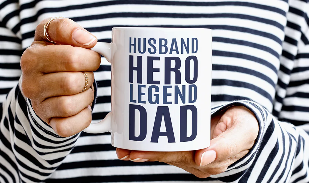 Mum and baby holding Printerpix cartoon design custom mug with dad text