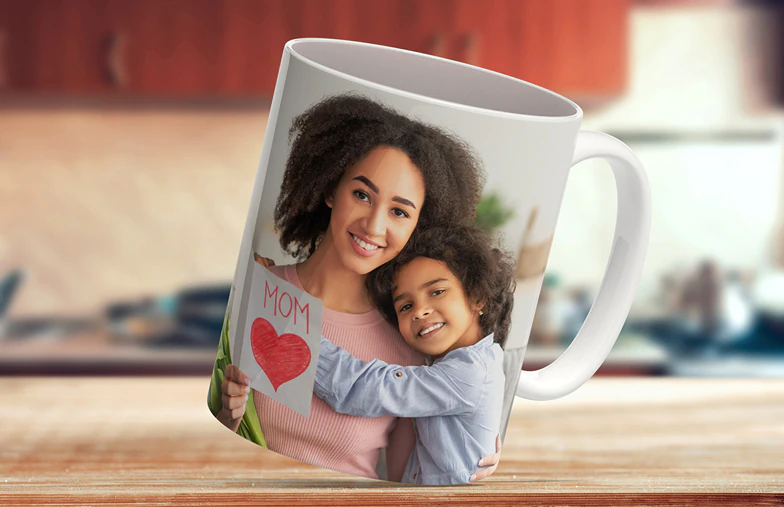 Mom and daughter holding custom designed photo mugs with family photos