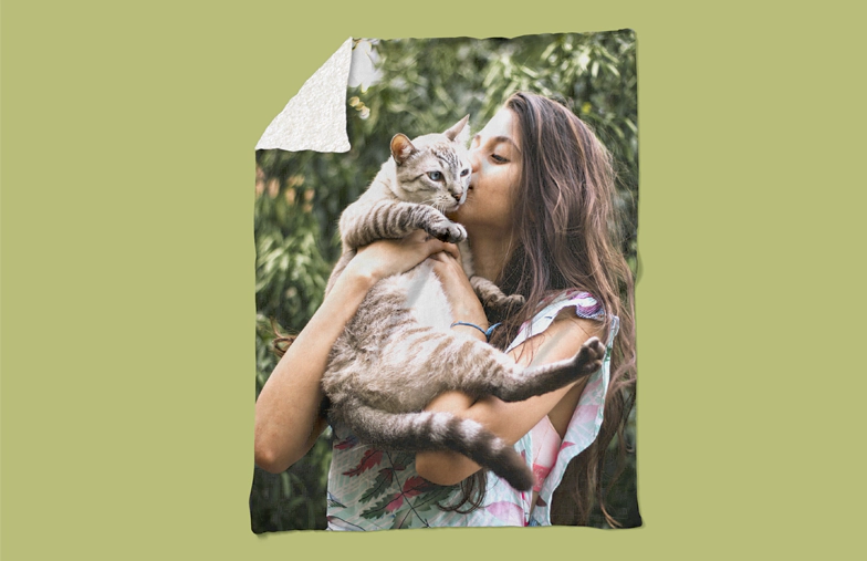 Romantic couple cuddling on balcony with large custom design mink touch photo blanket