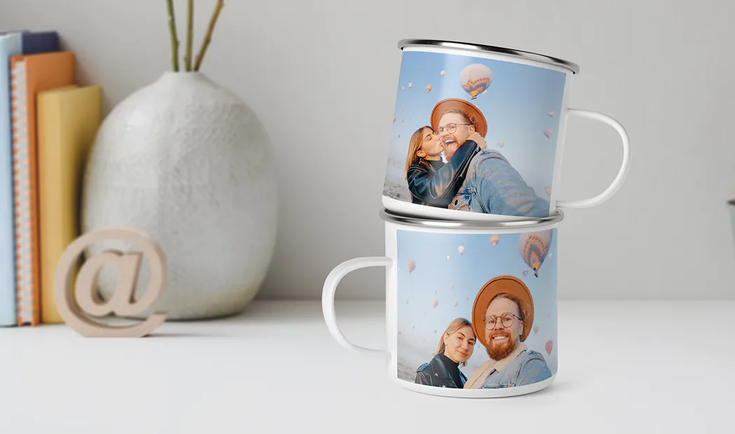 Mom and daughter holding custom designed photo mugs with family photos