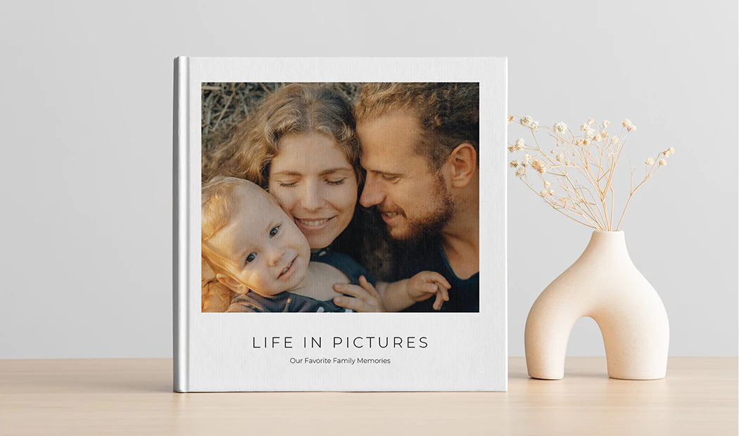 Custom printed Printerpix photo album with hard cover and large photos of young couple